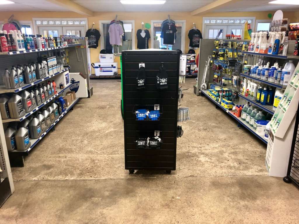A vending machine in the middle of a store floor.
