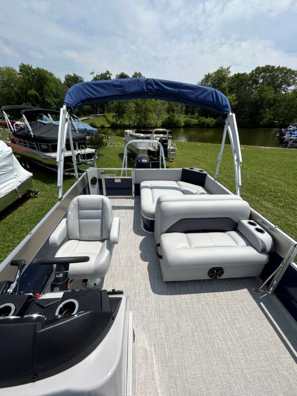 A boat with two seats and a canopy on it.