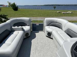 A boat with two couches and one couch in the back.
