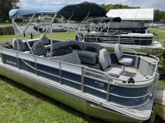 Blue and gray pontoon boat with canopy.