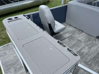 Gray boat with storage compartments.