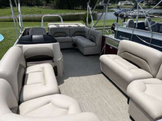 White leather seats in a pontoon boat.