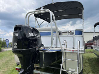 White pontoon boat with Suzuki engine.