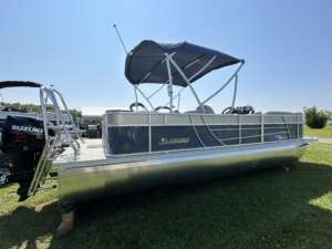 Silver pontoon boat with canopy.