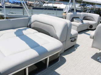 Gray boat seats with a gray carpet.