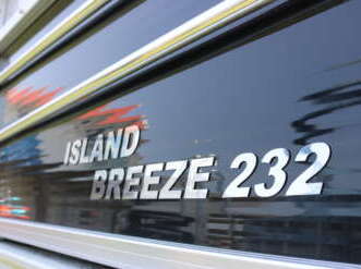 Island Breeze 232 boat nameplate on window.