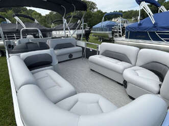 White pontoon boat with gray seating.