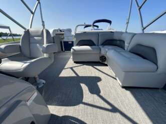 Grey upholstery on pontoon boat interior.