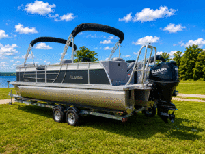 Pontoon boat on trailer by lake